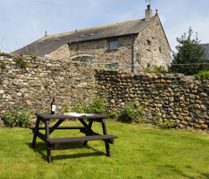 Enclosed rear garden with picnic table